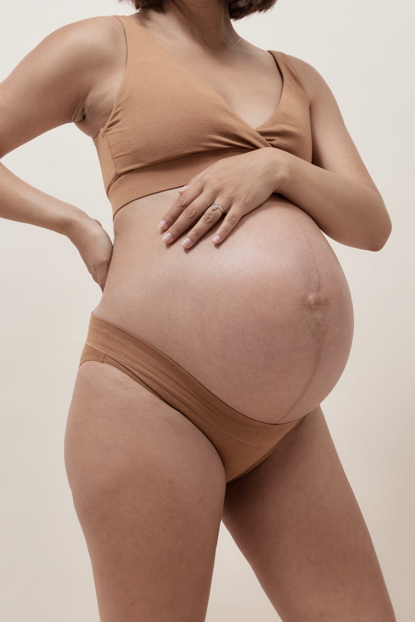 Pregnant woman wearing a neutral maternity underwear